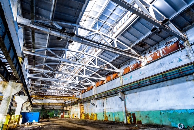 Strategic demolition of industrial warehouse for brownfield redevelopment into sustainable community space in urban renewal project