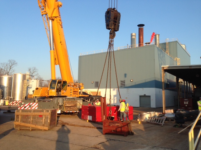 Riggers assembling tower crane sections during construction - R. Baker & Son - Master Riggers.